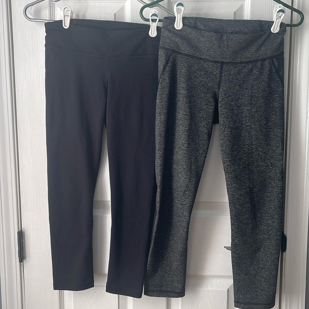 2 pair Under Armour cropped leggings black  and grey stripe- small